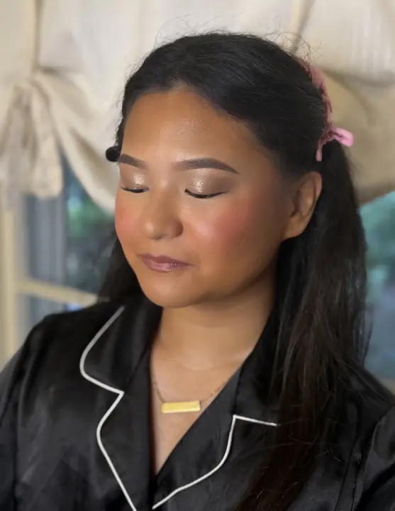 Bridal glam with a shimmer eye, full lashes and a rosy flush